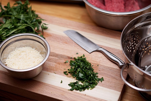 chef chopping vegetables on board